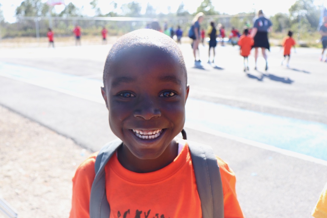 A smiling student on the school playground in Abaco